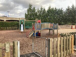 Image of playground in Bluewater showing a slide and fences